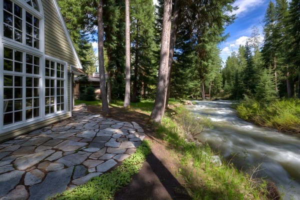 Enjoy the beautiful creek that runs alongside the home
