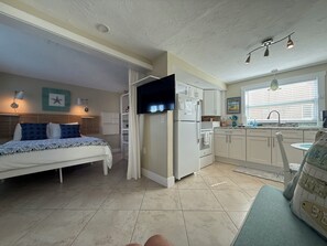 One bright room with everything you need. Queen bed, sofa bed, full kitchen, and the beach a minute out the door.