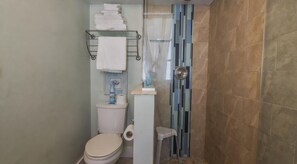 A walk-in shower to rinse off the beach. There is an outdoor shower too, so the sand mostly stays outside.