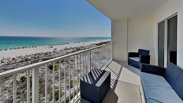 A balcony with a view of the beach and ocean. - Fort Walton Beach Condo | Complimentary Seasonal Beach Service & More! (Fort Walton Beach)