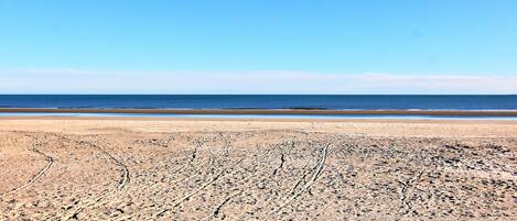 On the beach, sun loungers, beach towels