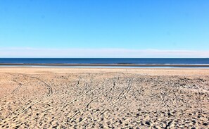 On the beach, sun-loungers, beach towels