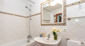 Bathtub, hair dryer, towels