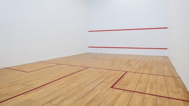 Habitación con suelo de madera y líneas rojas que marcan las paredes.