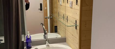 Bathtub, towels, toilet paper