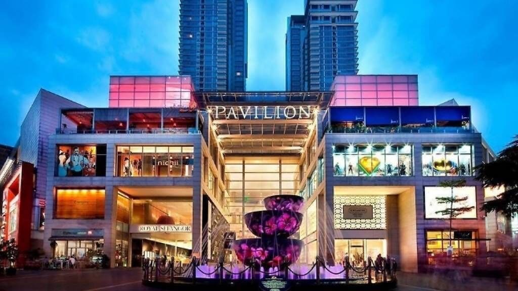 A multi-story shopping mall with the name "Pavilion" prominently displayed.