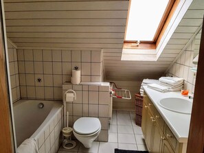 Combined shower/bathtub, hair dryer, towels, toilet paper