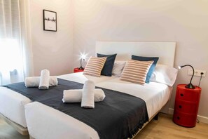 3 habitaciones, tabla de planchar con plancha y ropa de cama 