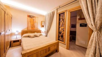 Enjoy a restful night's sleep in this inviting bedroom with a comfortable bed and a view of the outdoors.
