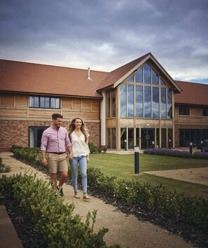 A building with a brick facade, large windows, and a sloped roof. - Sandburn Hall Hotel (York)