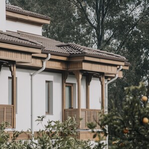 A building with a traditional architectural style, featuring wooden beams and a tiled roof. - Balèze Boutique Hotel - Adults Only (Ula)