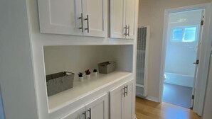 A kitchen with white cabinets, a countertop, and a built-in oven. - Westside turnkey 2 bd apt #6 (Culver City)