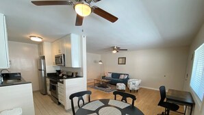 A compact living space with a kitchen, dining area, and seating area. - Westside turnkey 2 bd apt #6 (Culver City)