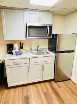 Fridge, microwave, coffee/tea maker, toaster