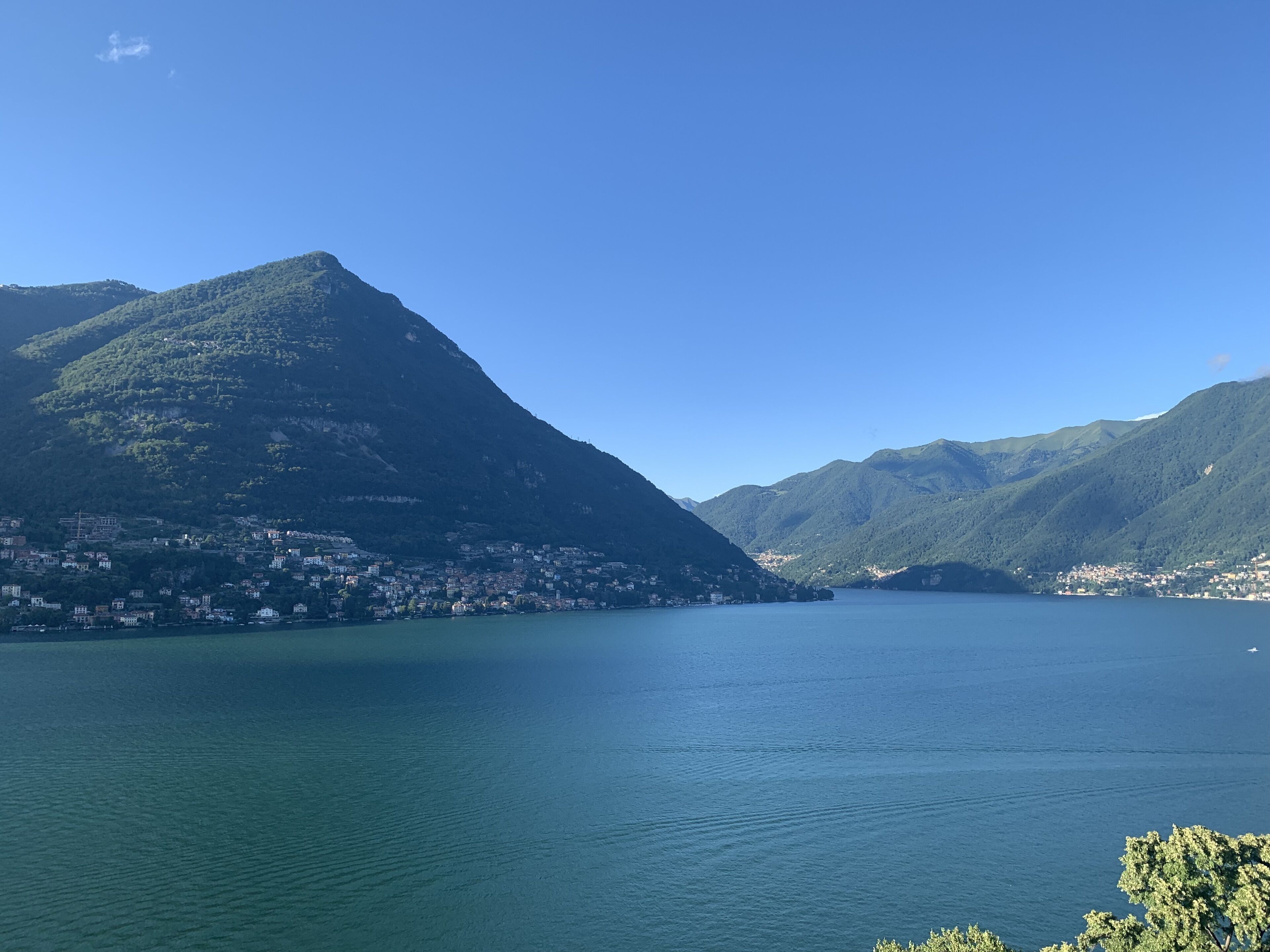 A mountainous landscape with a lake and a town.