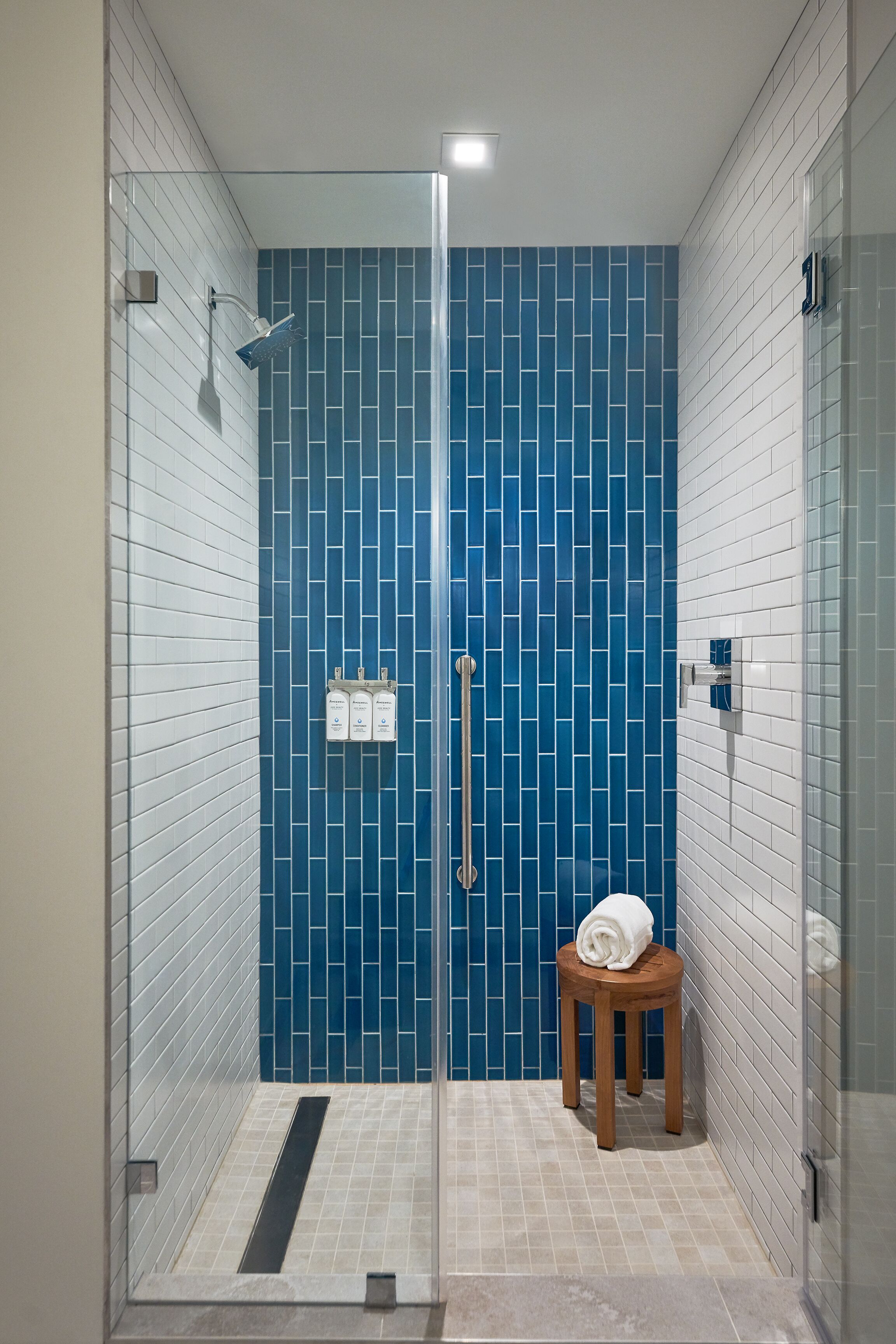 junior studio suite, 1 king bed | bathroom | rainfall showerhead, designer toiletries, hair dryer, bathrobes