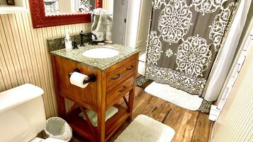 Bathtub, hair dryer, towels, soap