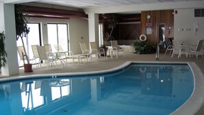 An indoor swimming pool with lounge chairs and a wooden wall. - Redecorated! Great Location at Mount Snow, Free Shuttle, Pool/Hot Tub (West Dover)