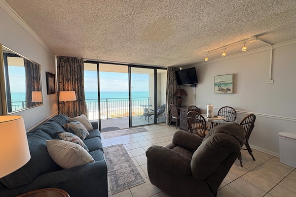 interior, indoor dining, couch, balcony, living area, TV , dining table,