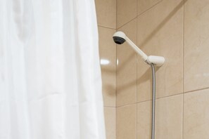 Bathtub, hair dryer, towels