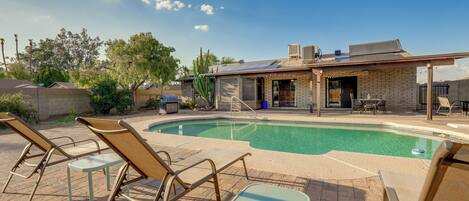 A heated pool, sun loungers