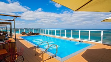 Seasonal outdoor pool, pool umbrellas