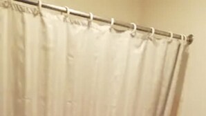 A bathroom with a shower curtain, a bathtub, and a toilet. - Unity Lodge Suite 2 (Golconda)