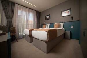 Pillowtop beds, minibar, desk, soundproofing