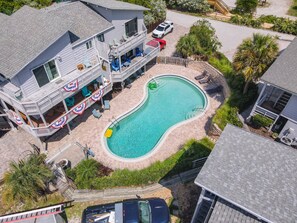 Enjoy a relaxing getaway with a pool and outdoor seating area.