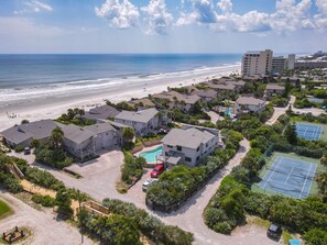 Enjoy stunning ocean views from this beachfront property, featuring a swimming pool, tennis courts, and beautifully maintained gardens.