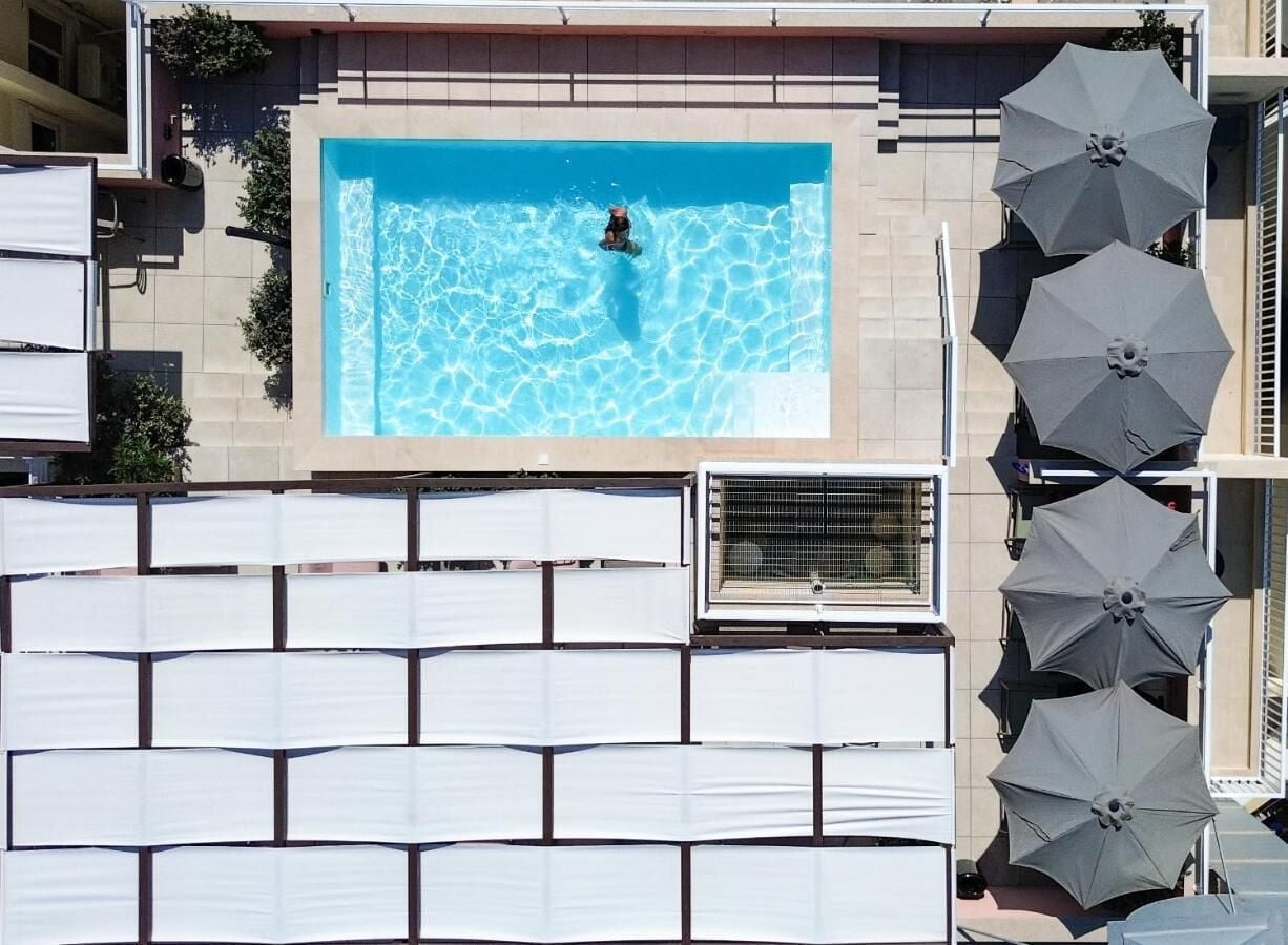 seasonal outdoor pool, open 8:00 am to 8:00 pm, pool umbrellas