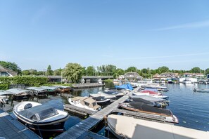 Stunning marina with boats docked at piers, surrounded by residential homes.