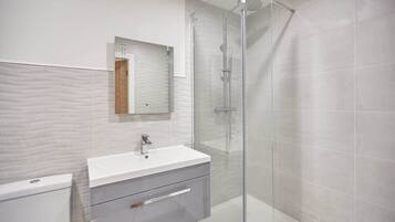 Bathtub, hair dryer, towels, soap