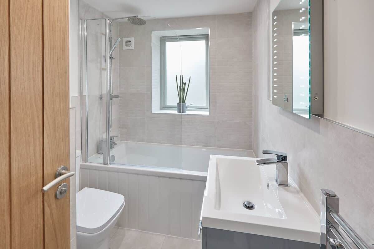 Bathtub, hair dryer, towels, soap