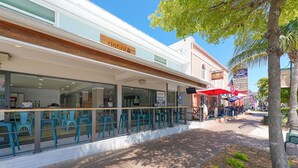 A restaurant with outdoor seating, a sign for 'ripfire' with a pizza menu, and a 'Zen Zone' massage therapy center in the background. - Siesta Key Village -Suite #2: A Block to the Beach, In the HEART of the Village! (Sarasota)