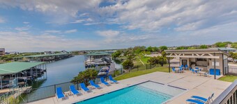 Lake front Condo 2BD/2BA w/ pool, hot tub, fire pit, gas grills, gym, & laundry.