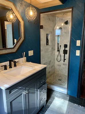 Shower, hair dryer, towels, soap
