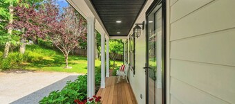 Coastal-style home with open-floor plan, ample natural light, blocks away...