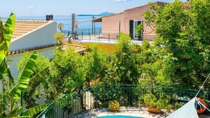 A swimming pool with a white canopy, surrounded by lush greenery and a clear blue sky. - Kalliopi Private Pool Walk to Beach A C Wifi Car Not Required - 179 (Corfu)
