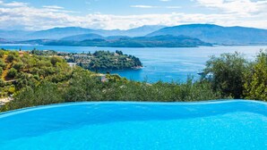 A clear blue swimming pool with a view of a lake and distant mountains. - Bougainvillea Large Private Pool Walk to Beach Sea Views A C Wifi Car Not Required Eco-friend - 195 (Corfu)