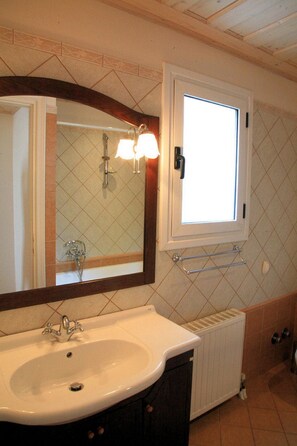 A bathroom with a white sink, a large mirror, a window, and a towel rack. - Villa Emilios Large Private Pool Sea Views A C Wifi - 217 (Corfu)