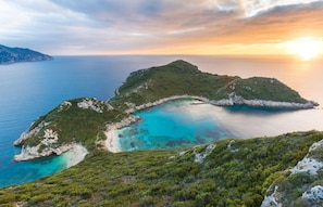 A coastal landscape with a clear view of a bay surrounded by green hills and rocky outcrops. - Villa Emilios Large Private Pool Sea Views A C Wifi - 217 (Corfu)