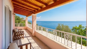 A balcony with a wooden ceiling, white railing, and a view of the sea. - Villa Petros Large Private Pool Walk to Beach Sea Views A C Wifi Car Not Required - 180 (Corfu)