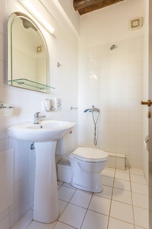 A small, clean bathroom with a white sink, toilet, and shower. - Villa Tzina Large Private Pool Walk to Beach A C Wifi Car Not Required - 1604 (Platanias)