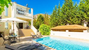 A two-story house with a swimming pool, outdoor furniture, and a staircase leading to the upper floor. - Villa Ismini Large Private Pool A C Wifi Eco-friendly - 1877 (Kefalonia)