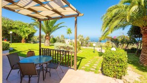A patio with a table and chairs, a pergola, and a view of the sea. - Villa Sevos Large Private Pool Sea Views A C Wifi Car Not Required - 1891 (Rethymno)