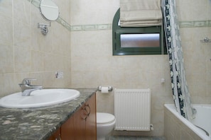 A bathroom with a sink, toilet, and bathtub. - Villa Charianna Large Private Pool Walk to Beach Sea Views A C Wifi Car Not Required Eco-frie - 1985 (Ayia Marina Chrysochous)