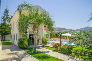 A two-story house with a pool, surrounded by greenery and a clear view of the hills. - Villa Charianna Large Private Pool Walk to Beach Sea Views A C Wifi Car Not Required Eco-frie - 1985 (Ayia Marina Chrysochous)