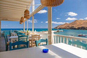 Enjoy a tranquil meal with a breathtaking view of the sea and surrounding mountains.