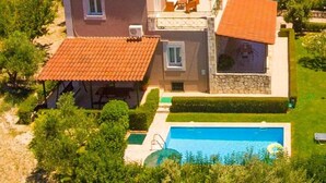 A two-story house with a swimming pool, surrounded by greenery and a mountainous backdrop. - Villa Giannis Large Private Pool Walk to Beach A C Wifi Car Not Required Eco-friendly - 2088 (Apokoronas)